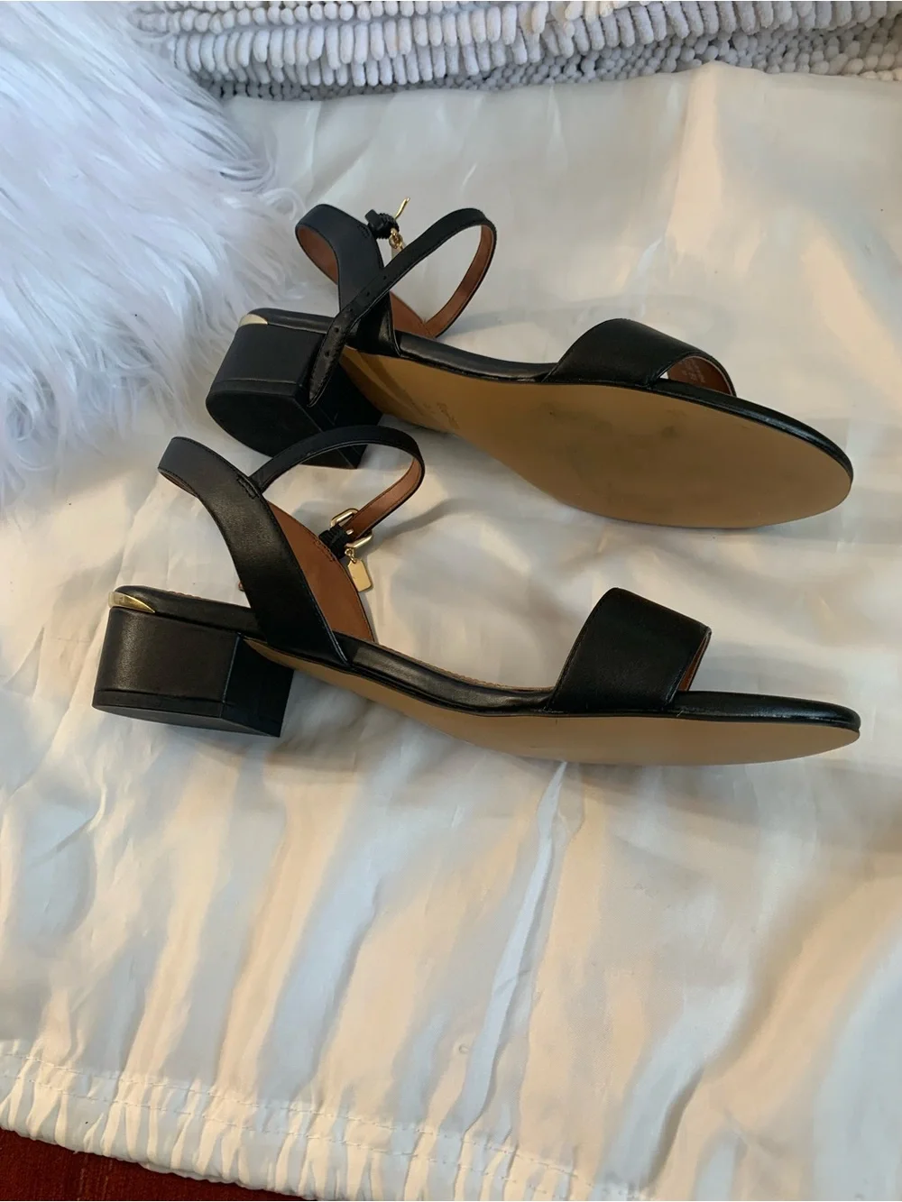 NWOT. Coach smooth leather, black sandals. Gold hardware.